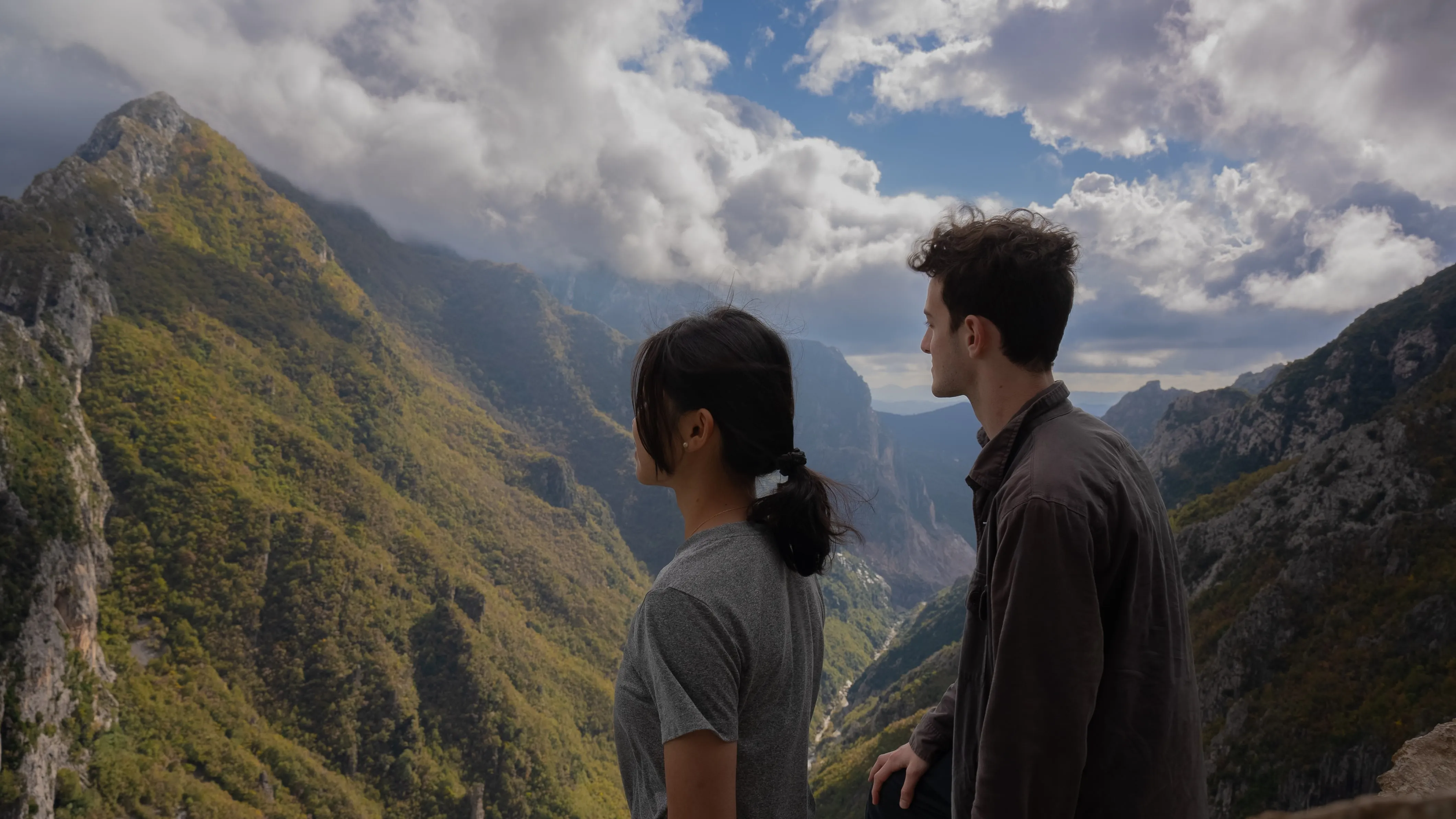 Guy and girl looking at mountain view