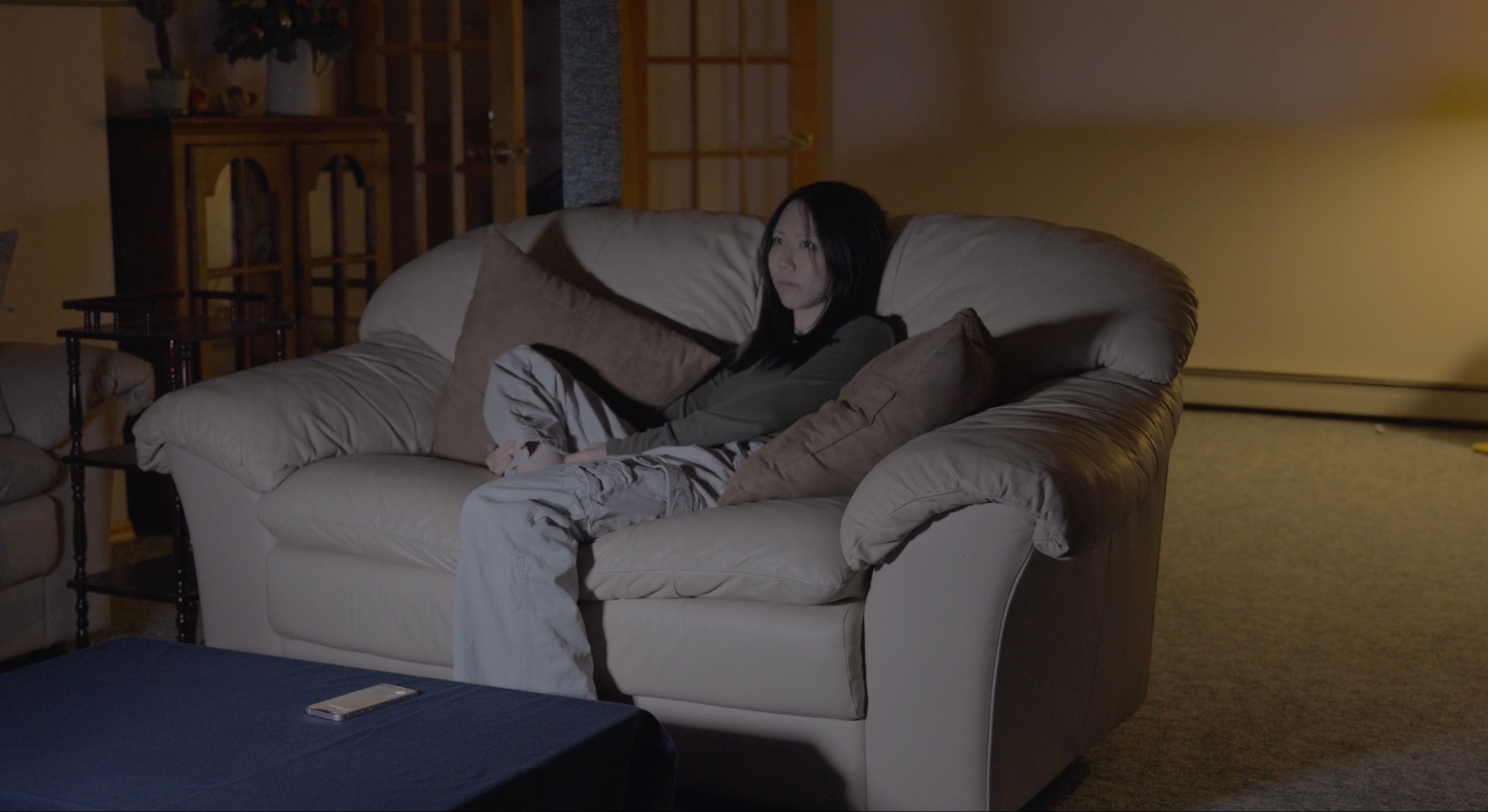 Main character grabbing her study notebook to close