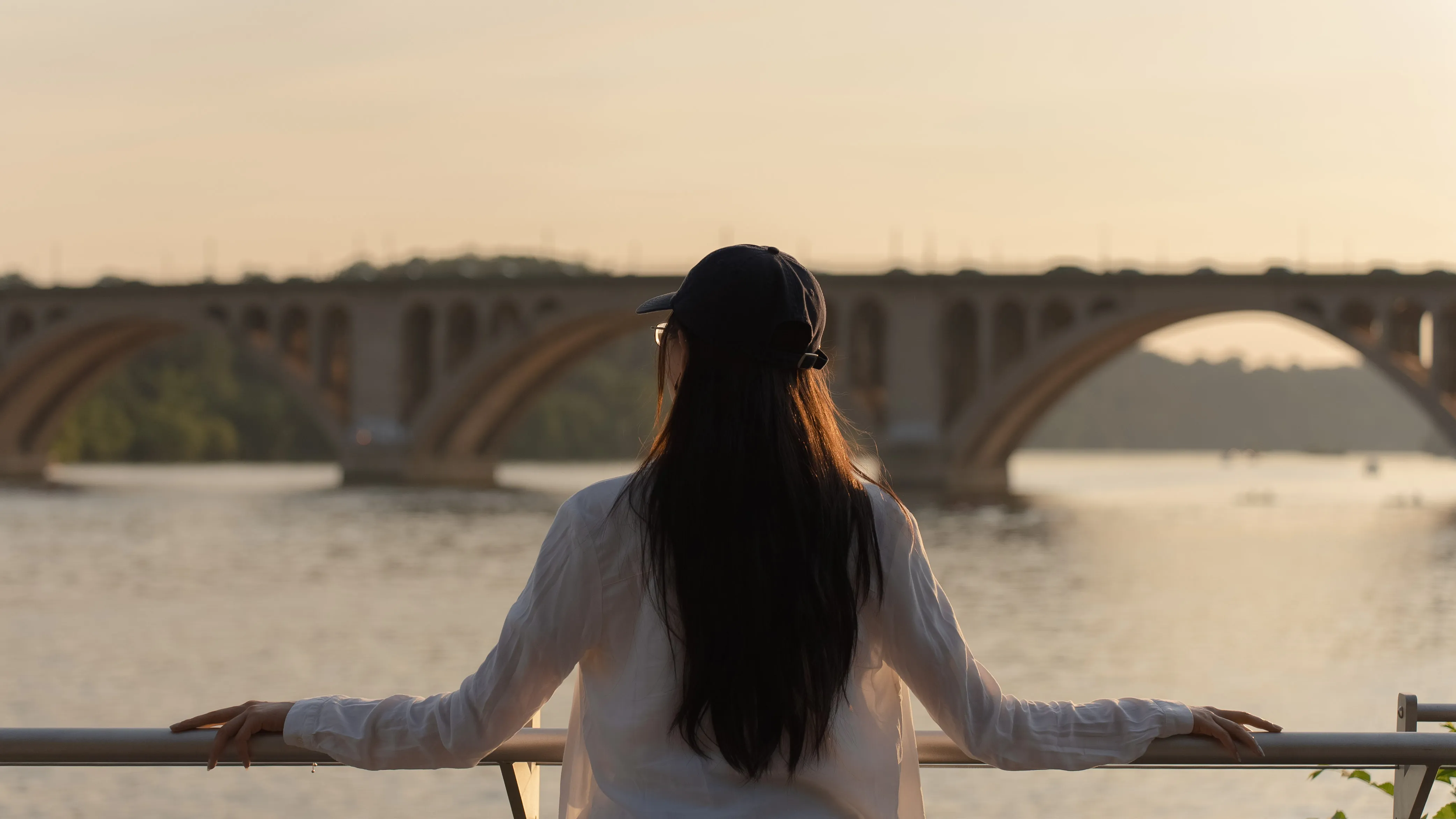girl with bridge in back