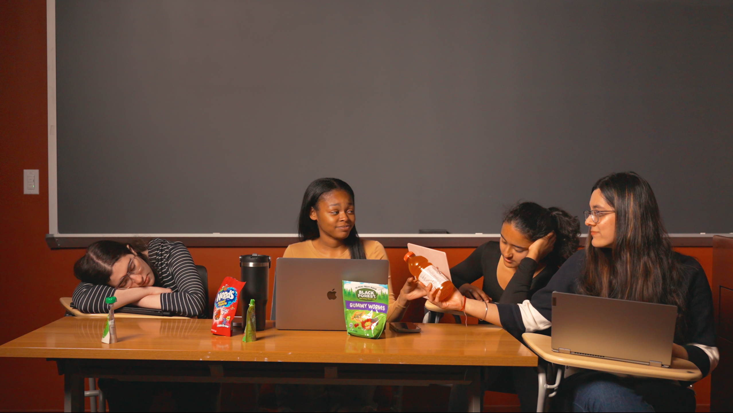 Group of sleepy girls in a classroom with computers