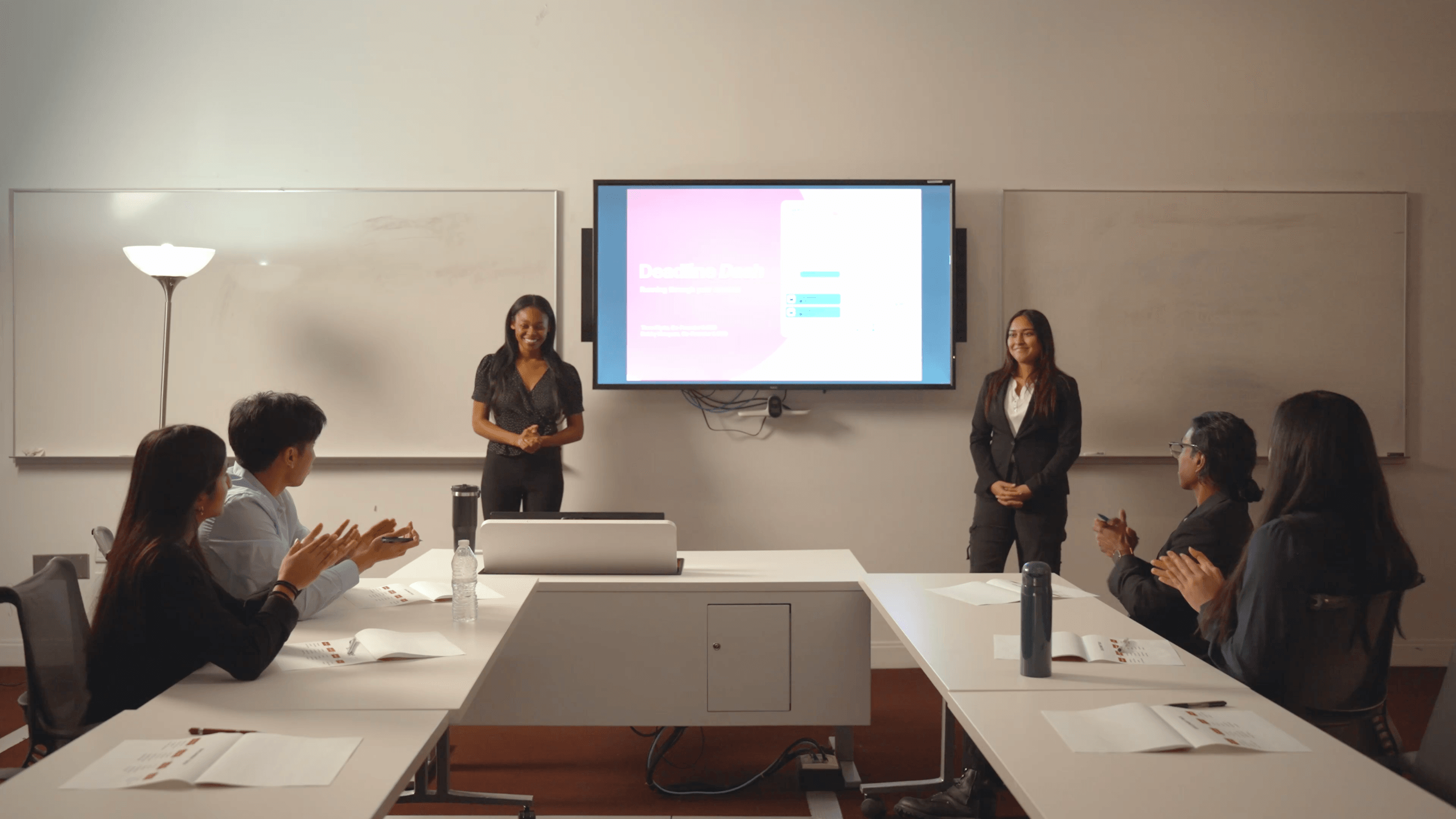 Two ladies pitching to investors