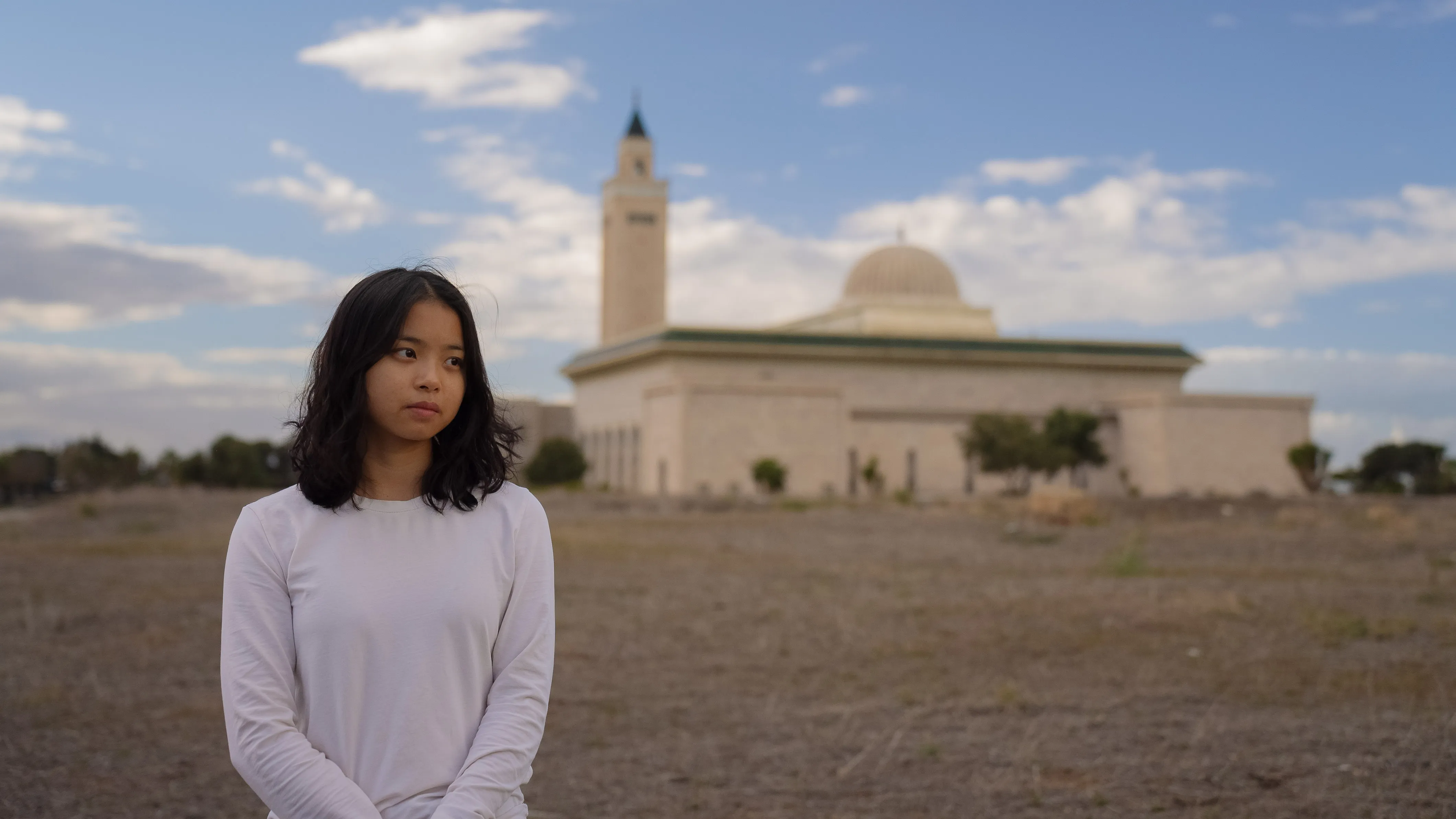 girl in front of mosque