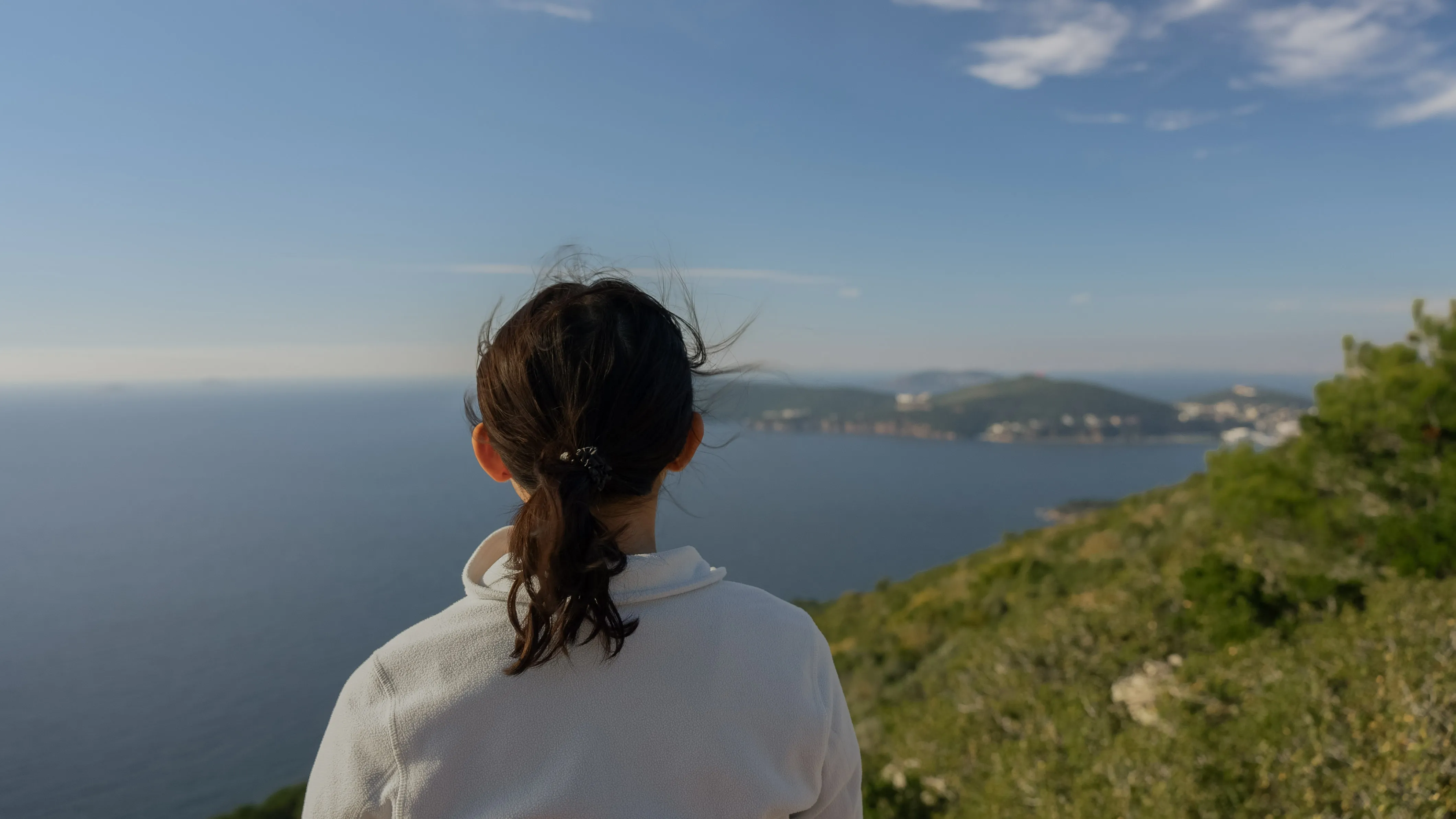 Girl standing in front of island view