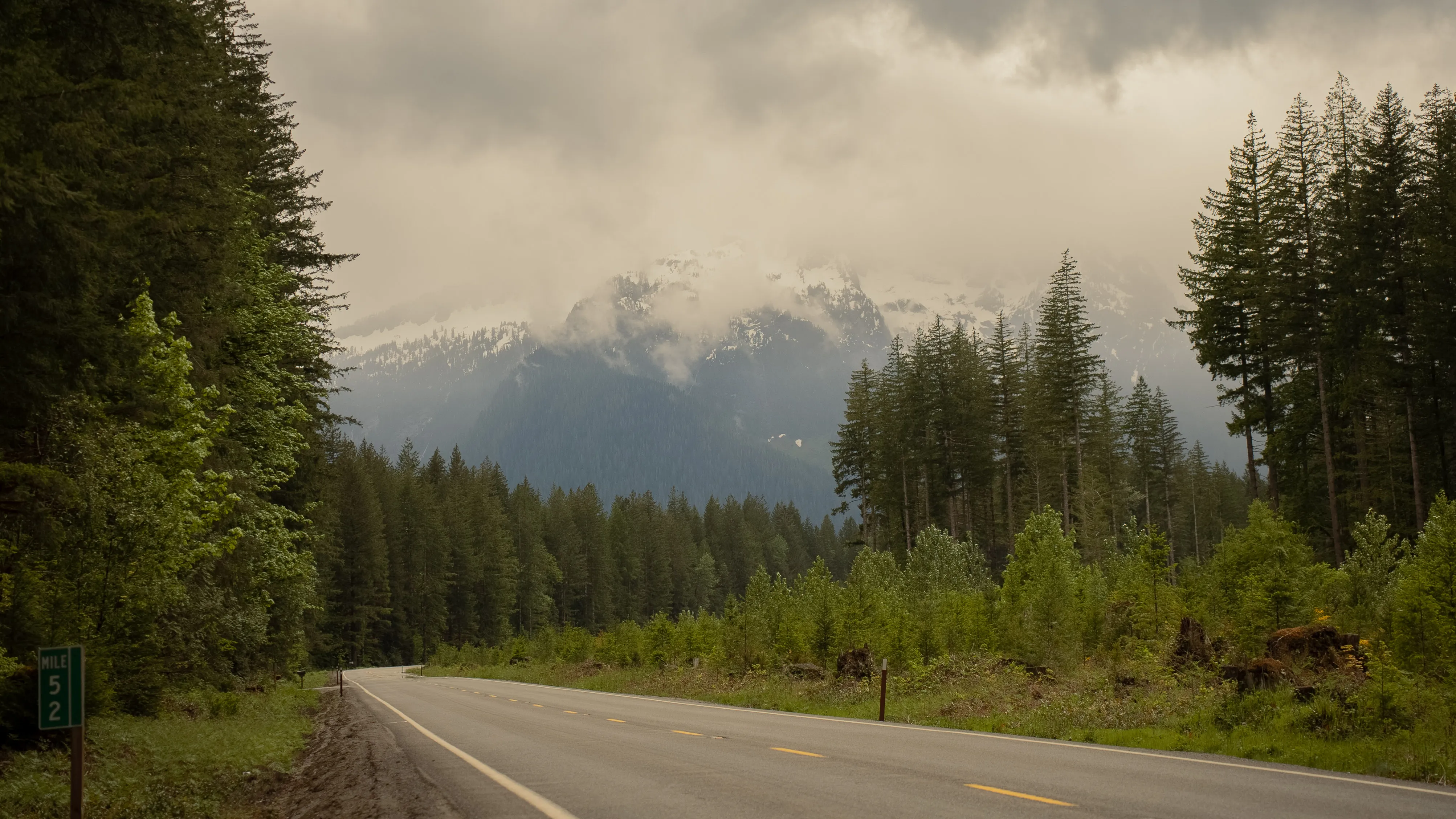 road with mountain behind