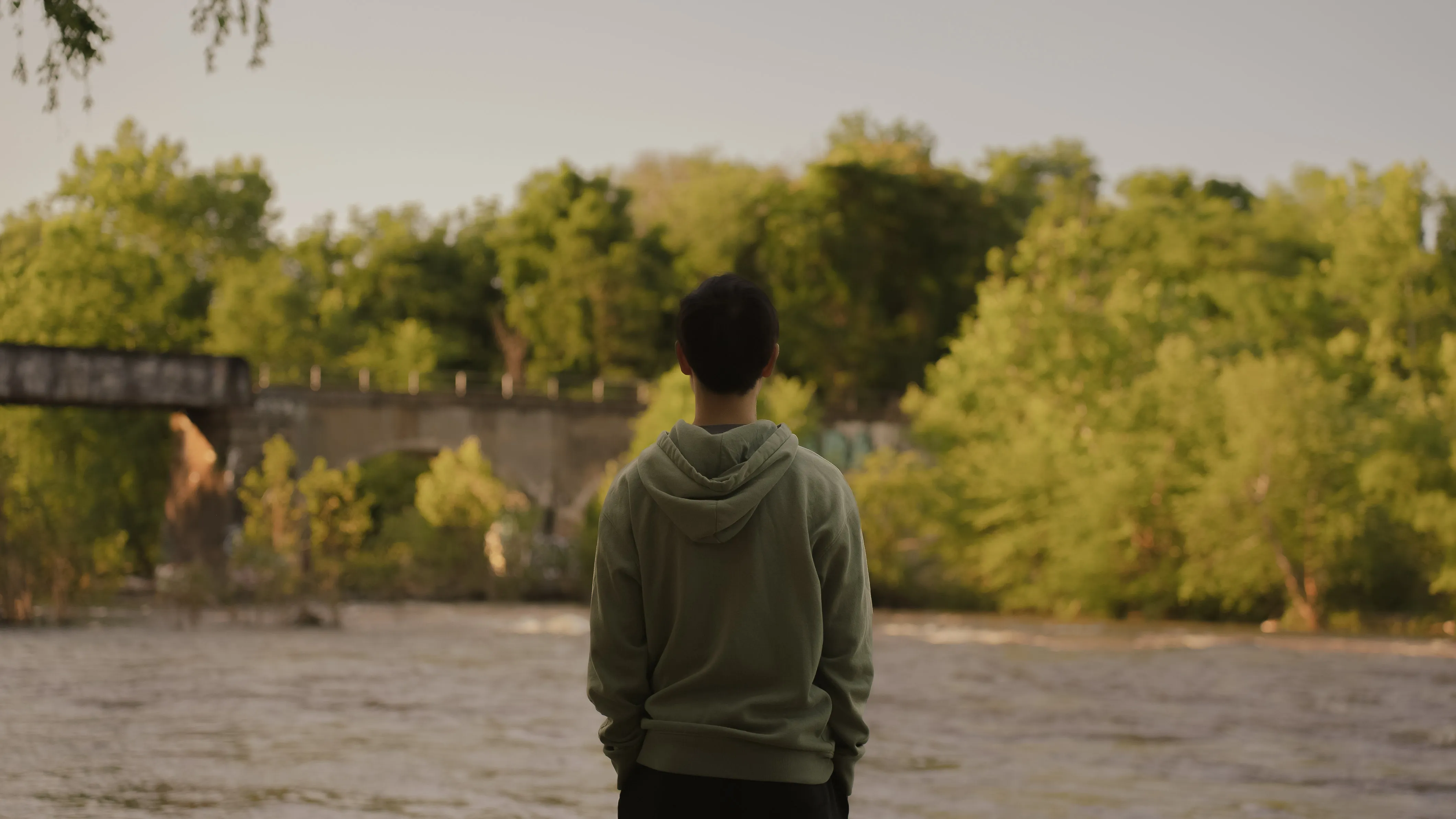 Guy standing at river