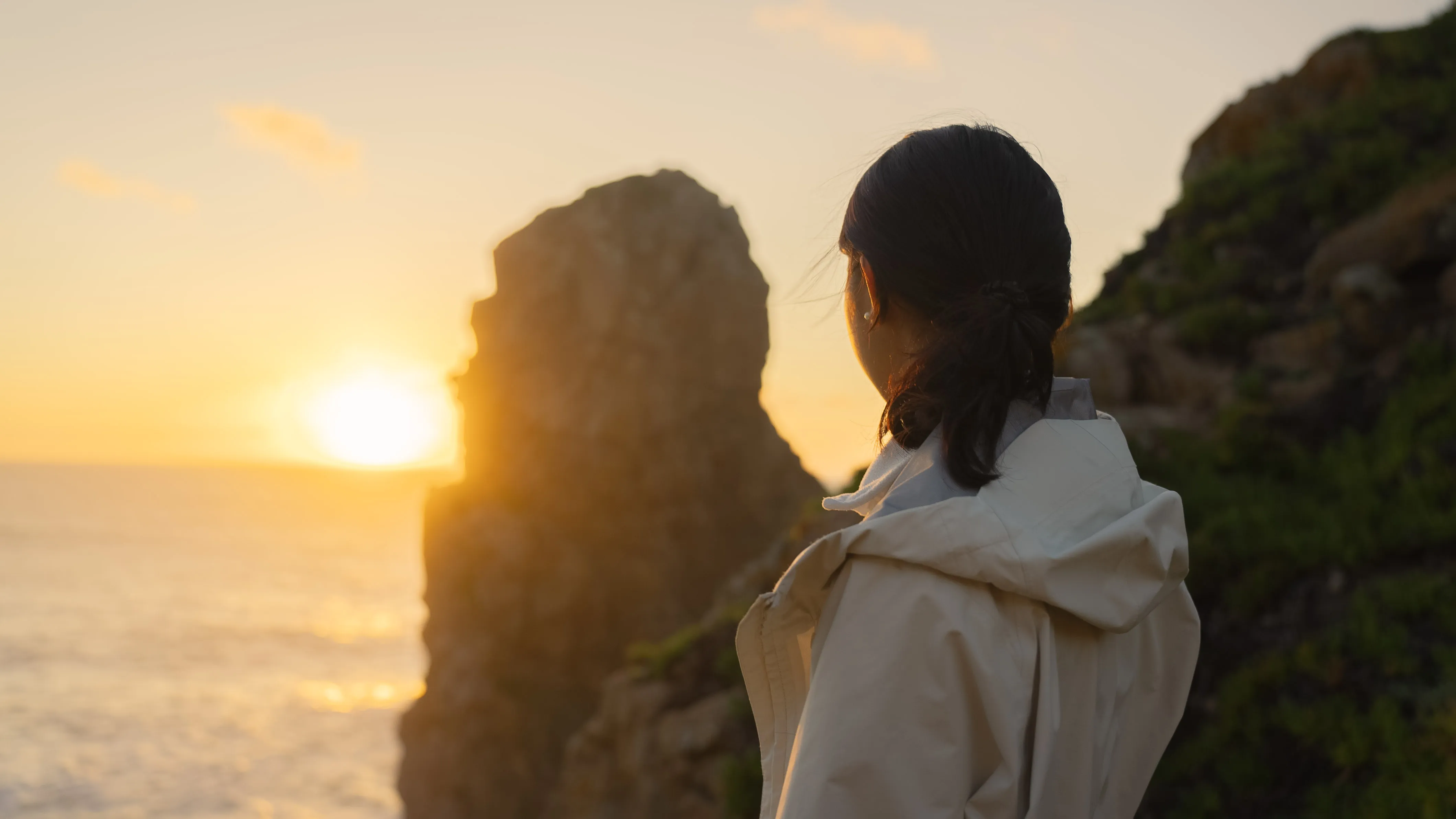 girl with sunset at coast