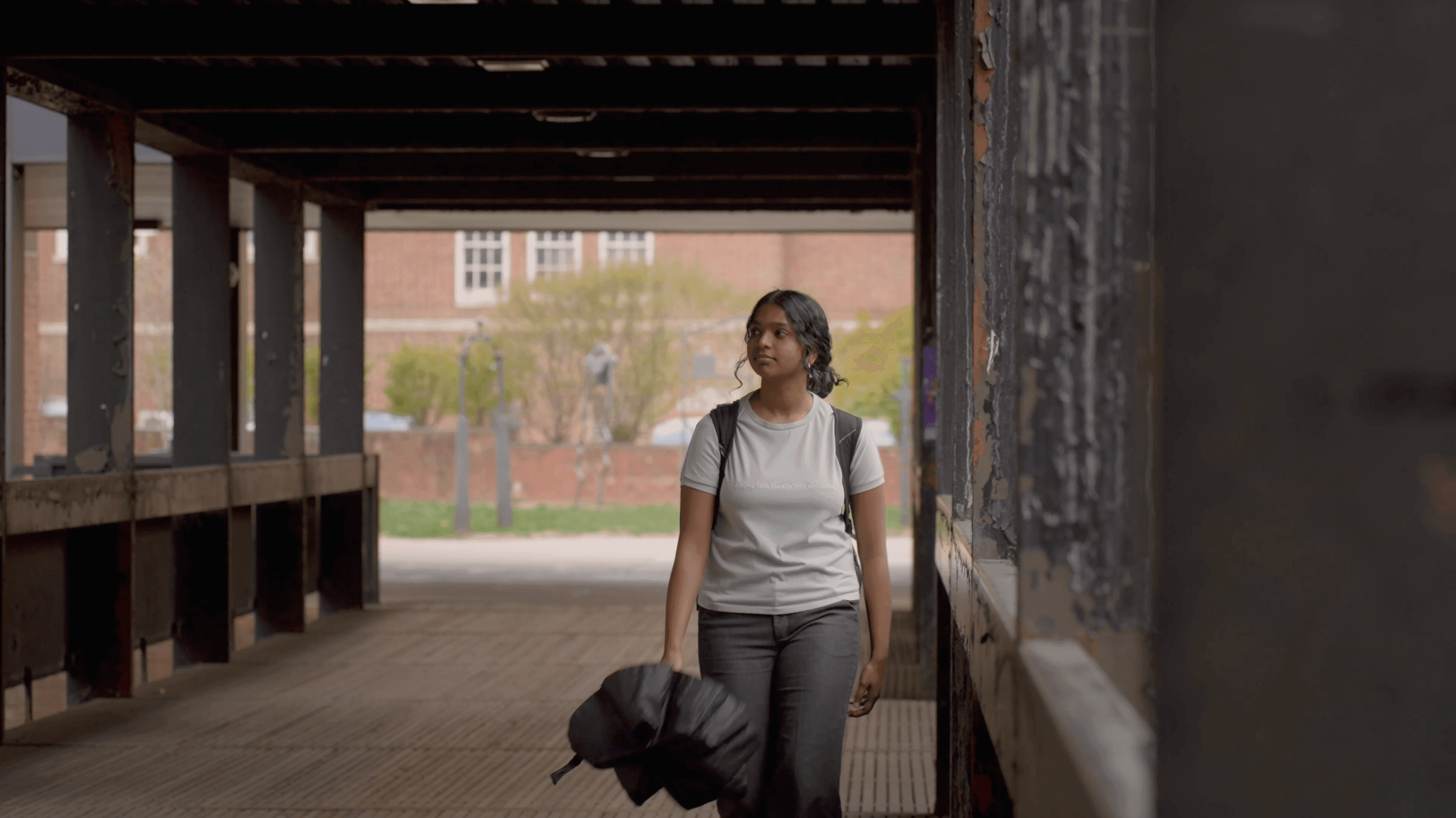 Main character walking past the Kissing Bridge