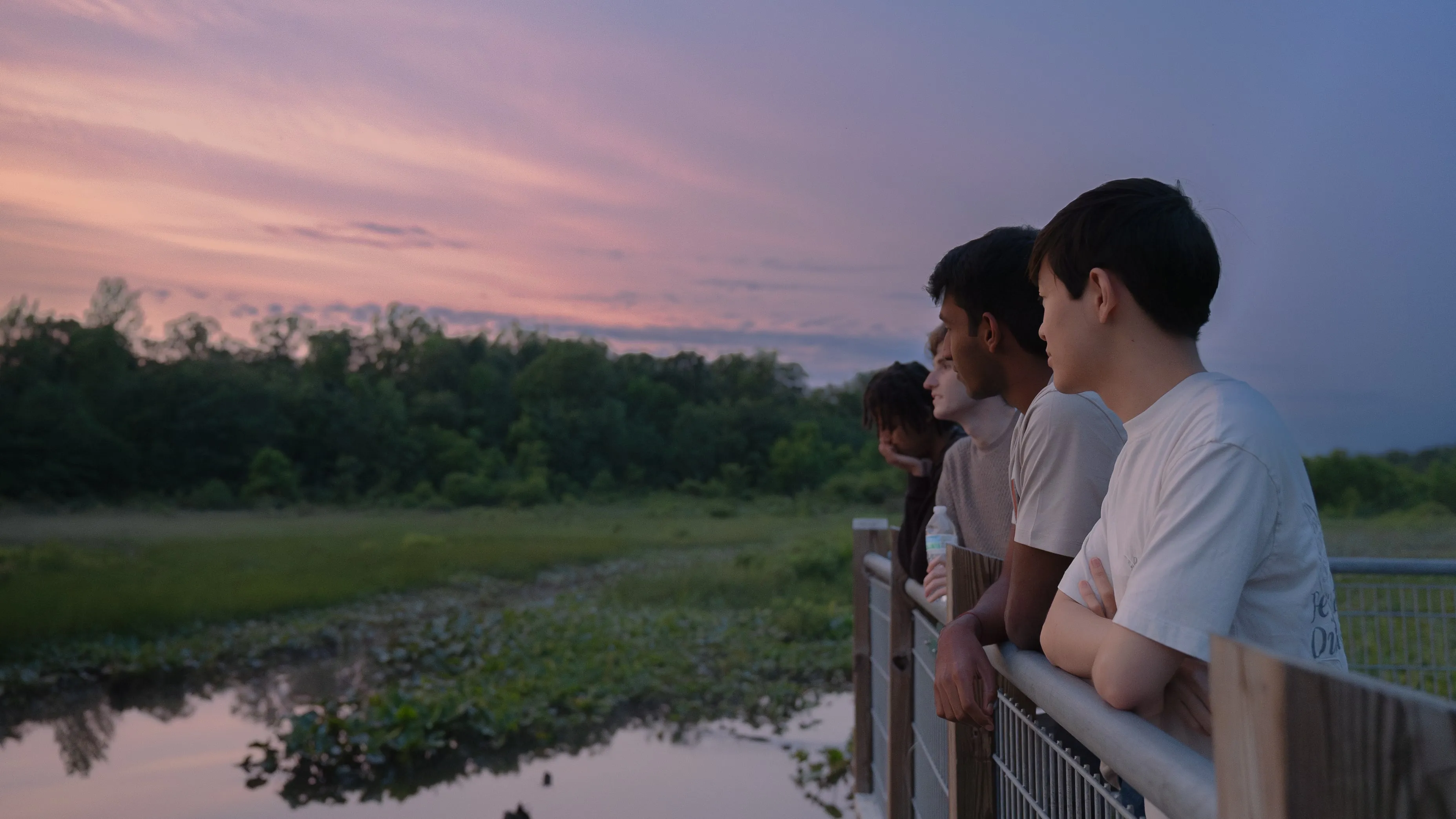 Group of boys posing at swamp boardwalk